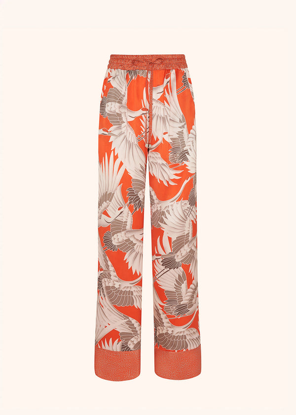 Kiton pantalon à coulisse en soie d’inspiration orientale de couleur orange pour femme.