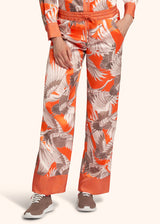 Kiton pantalon à coulisse en soie d’inspiration orientale de couleur orange pour femme.