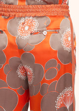 Kiton pantalon à coulisse en soie d’inspiration orientale de couleur orange pour femme.