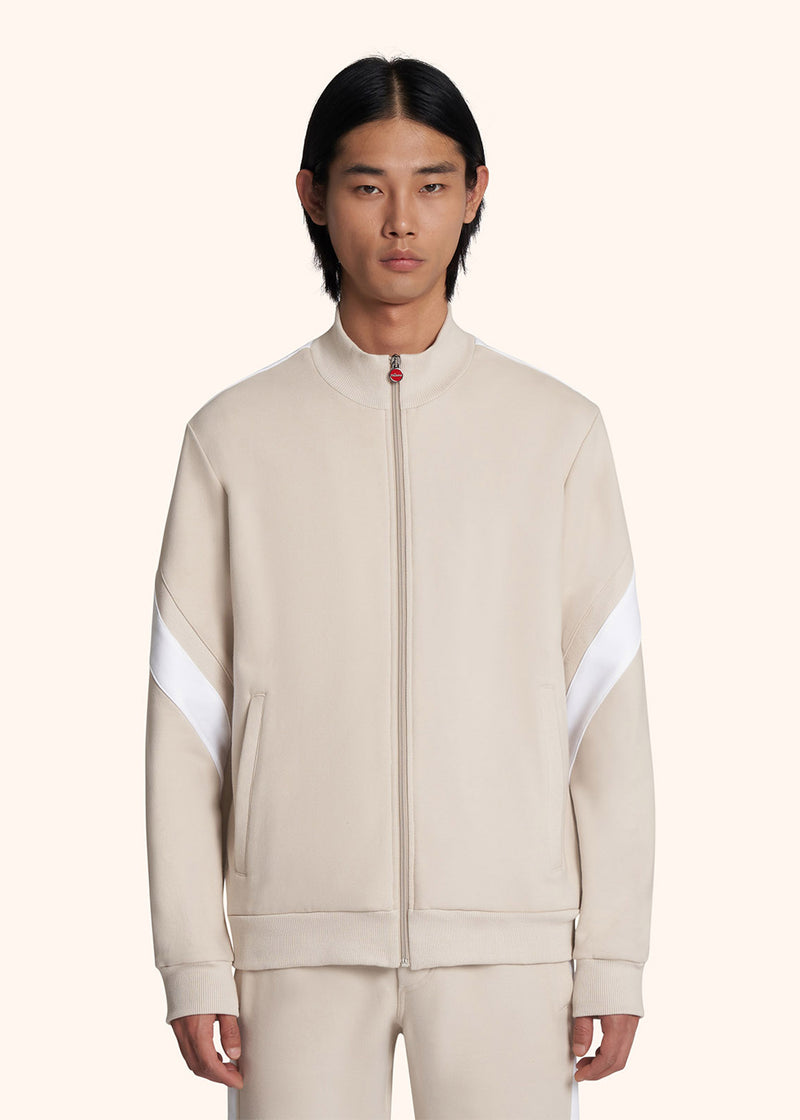 Kiton veste modèle sweat de couleur beige avec détails bandes de couleur blanche pour homme.